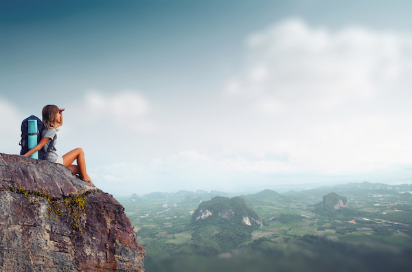 Lady Hiker Sitting On Mountain