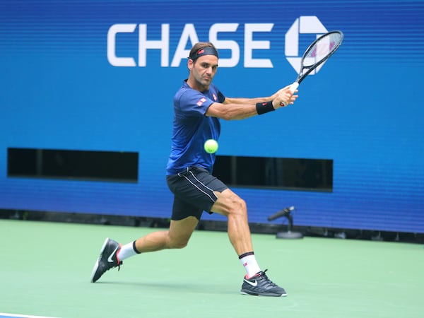 Roger Federer US Open 2019 Wearing Light and Dark Blue Uniqlo wear and Nike Shoes.