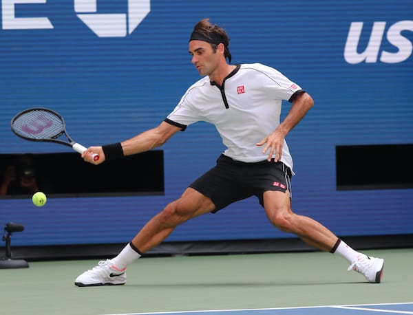 Roger Federer - Full Body Shot - US Open 2019 - Wearing white and black Uniqlo set - And white Nike Shoes.