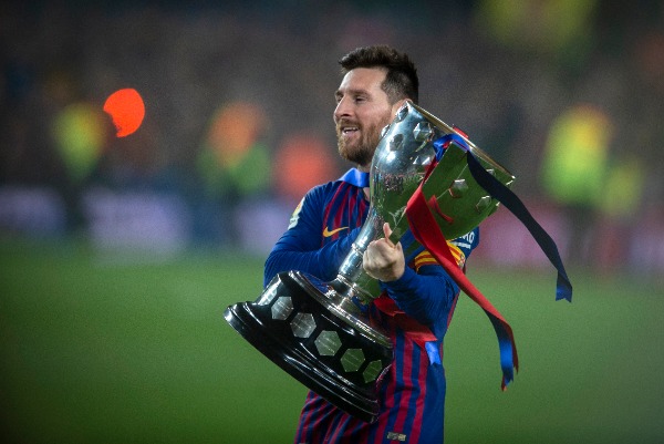 Lionel Messi of FC Barcelona holds the champion trophy after his team defeated Levante UD during their 35th round match of the La Liga 2018-2019 season at Camp Nou Stadium in Barcelona, Spain, 27 April 2019.