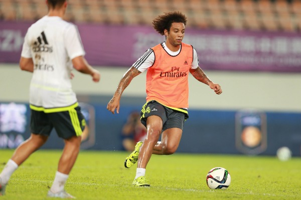 Marcelo Vieira, right, and teammates of Real Madrid take part in a training session in Guangzhou city, south China's Guangdong province, 26 July 2015