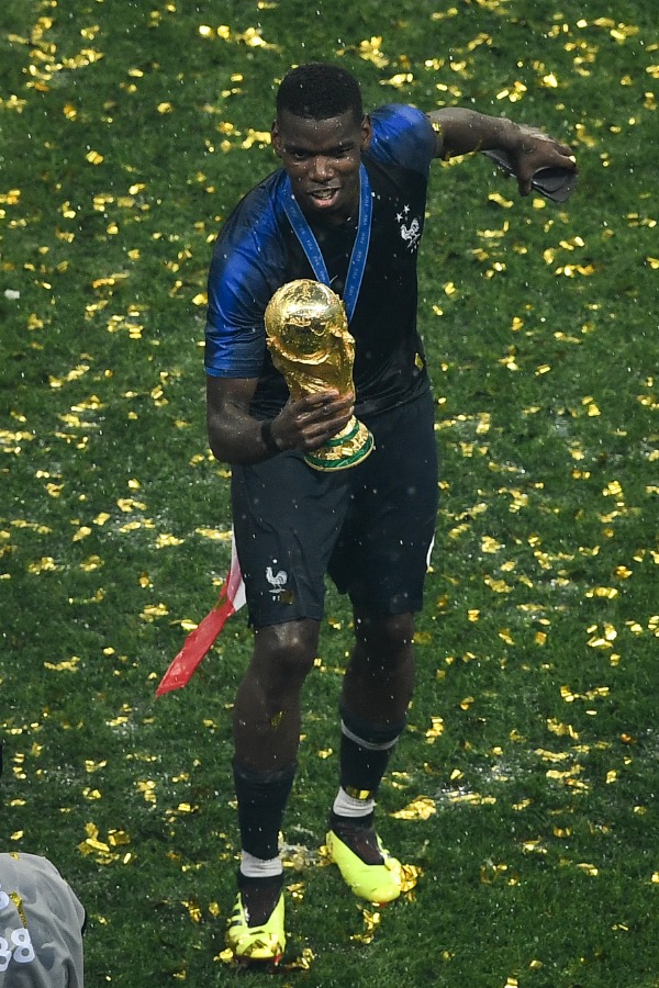 Paul Pogba of France poses with the World Cup trophy after France defeated Croatia in their final match during the 2018 FIFA World Cup in Moscow, Russia, 15 July 2018.