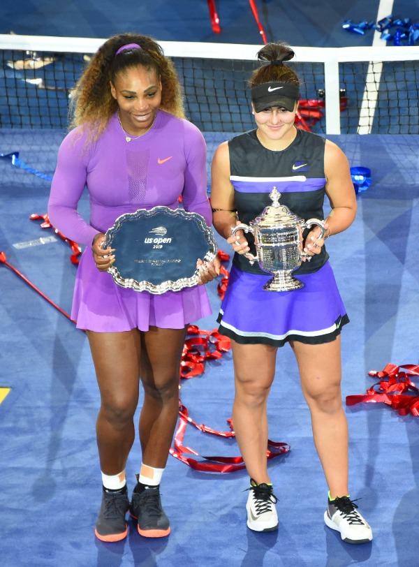 NEW YORK - SEPTEMBER 7, 2019: Finalist Serena Williams (L) and 2019 US Open champion Bianca Andreescu of Canada during trophy presentation at Billie Jean King National Tennis Center in New York