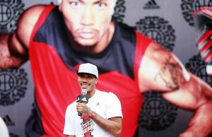 NBA star Derrick Rose of the Chicago Bulls speaks at a meeting with fans during his China tour in Shanghai, China, 23 August 2011